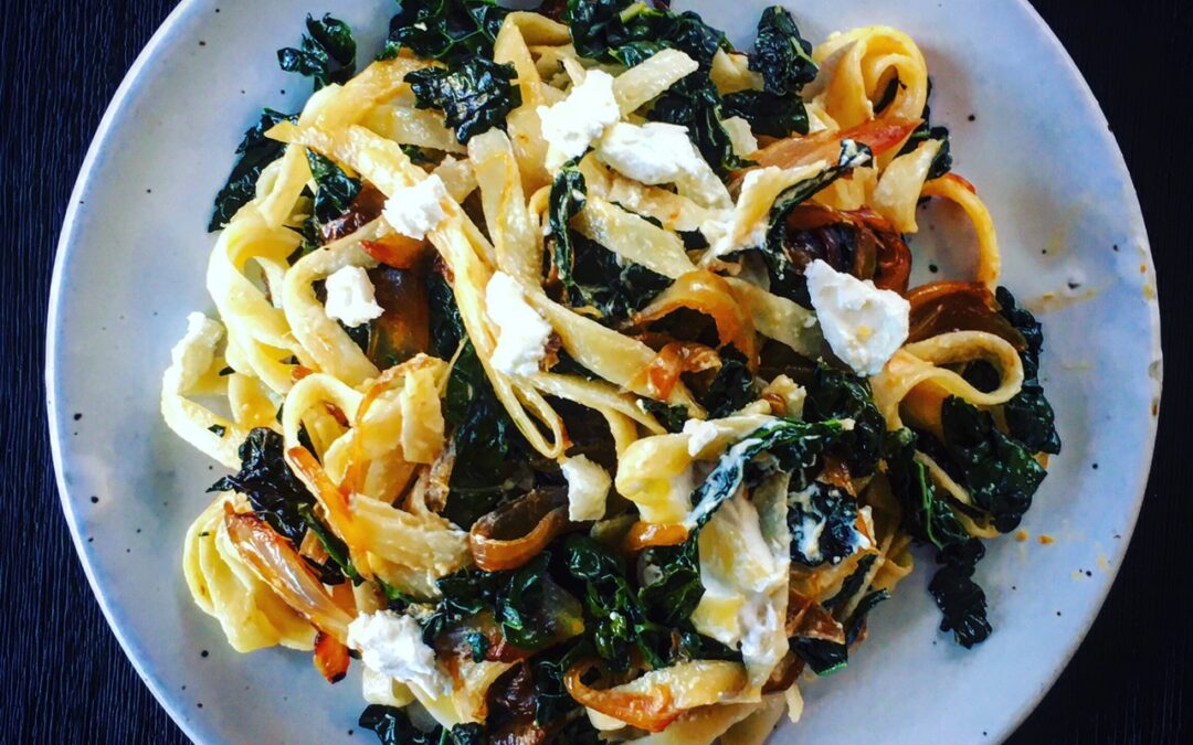 Fettuccini with Kale, Caramelized Onions & Goat Cheese
