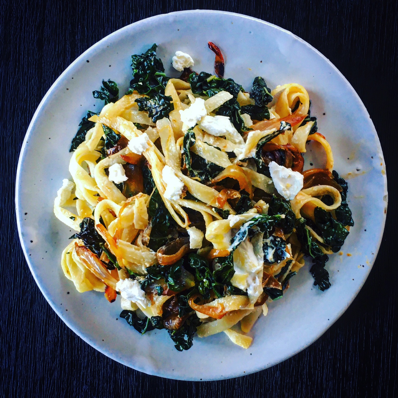 Fettuccini with Kale, Caramelized Onions & Goat Cheese